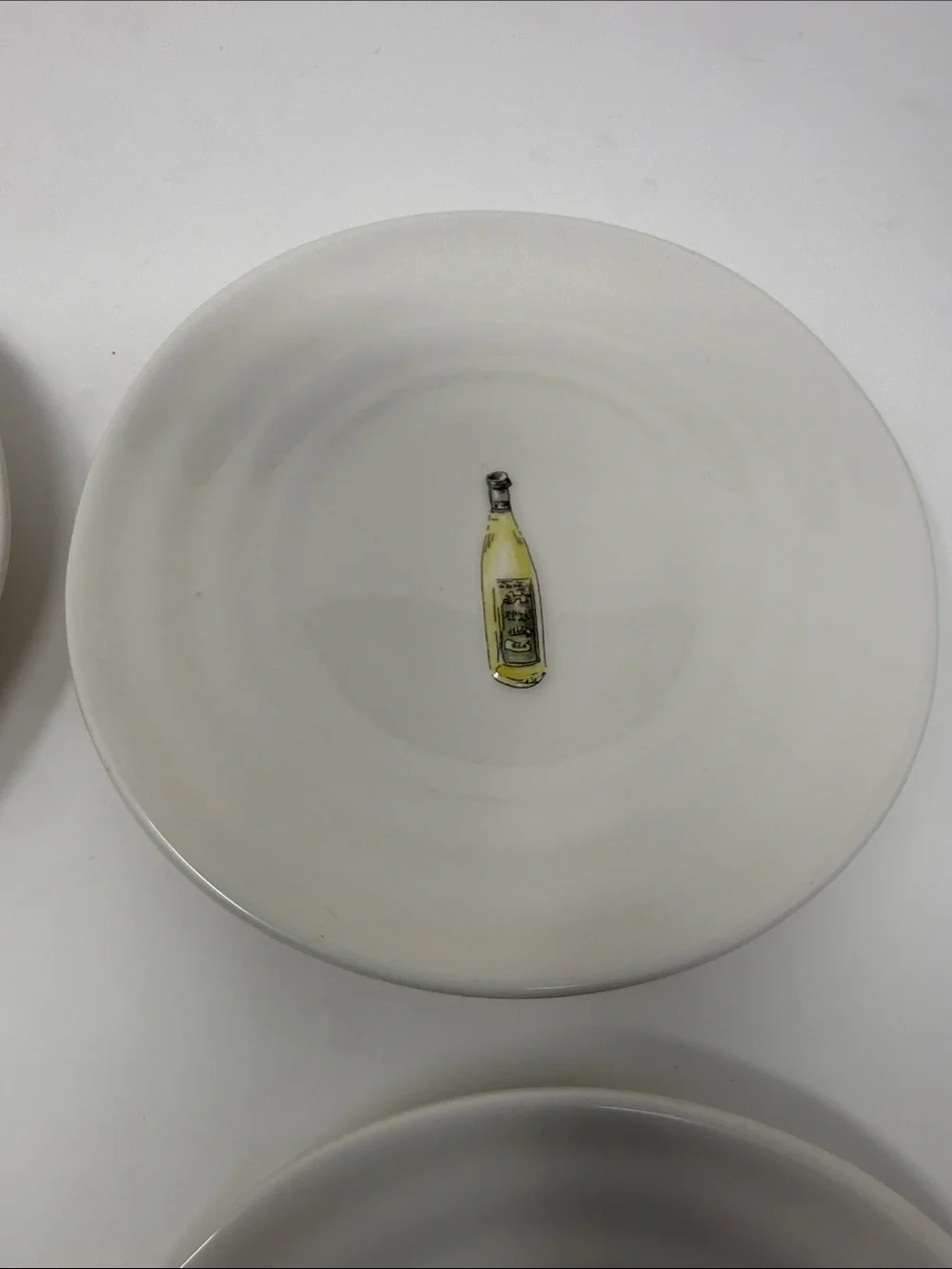 Williams Sonoma Cream Ceramic Dinner Plates with Wine Bottle Motifs - Set of 4